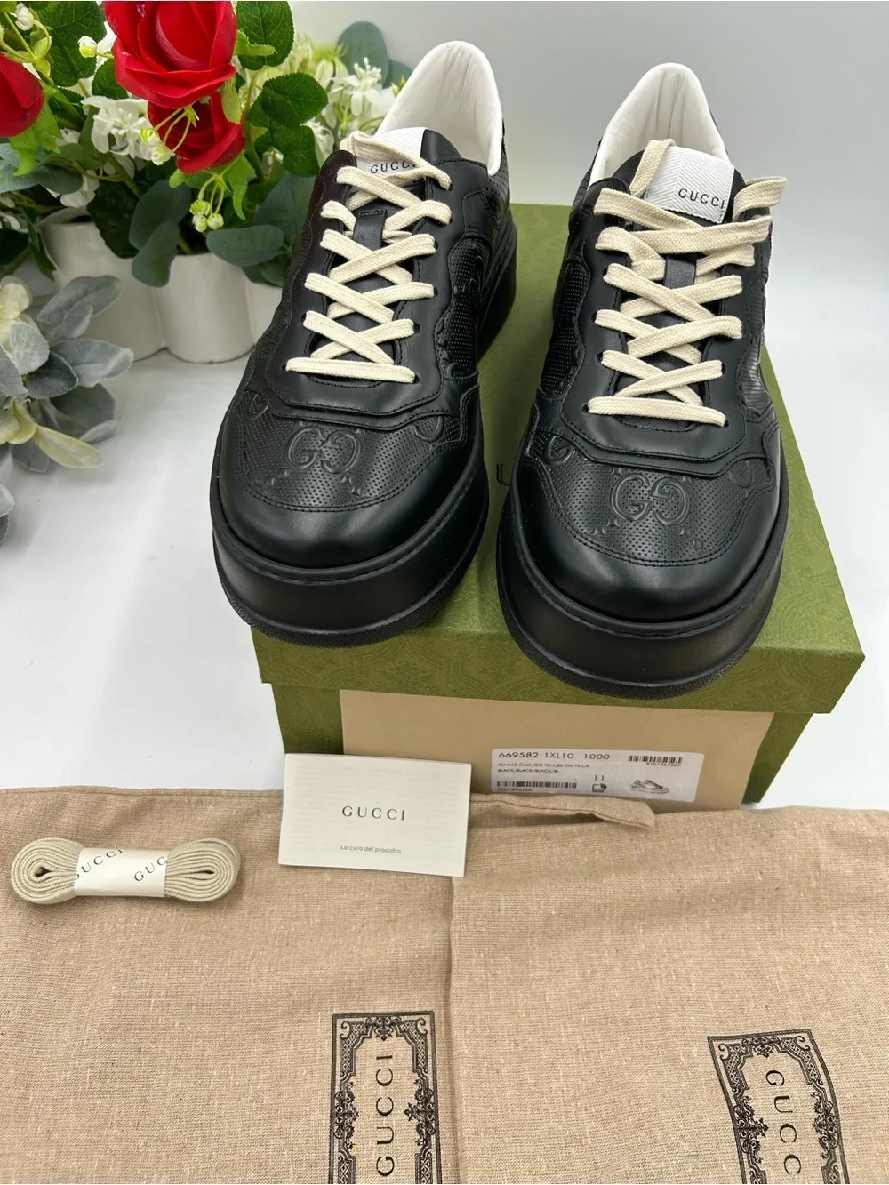 Men's Gucci, GG embossed, black leather sneakers size 11 fits 11.5 made in Italy